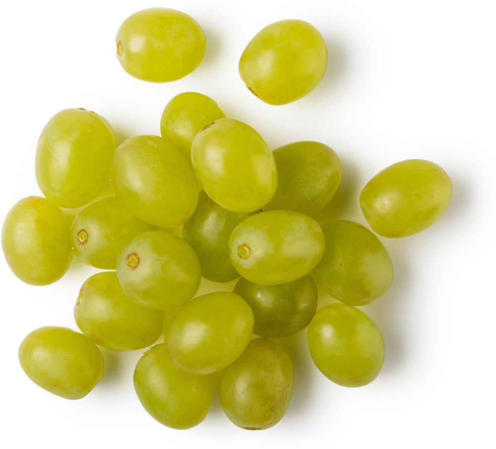 A Bottle Of Organic Grape Seed Oil With Fresh Green Grapes